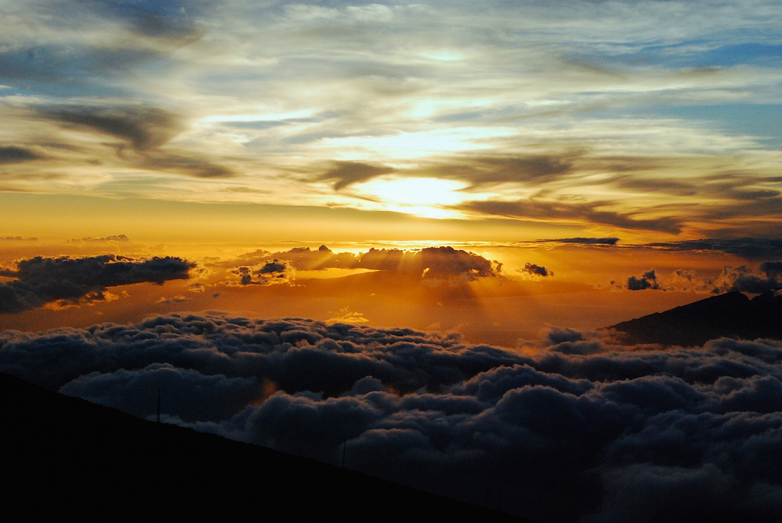 Sunset as viewed from summit of Haleakala Volcano, Maui, Hawaii