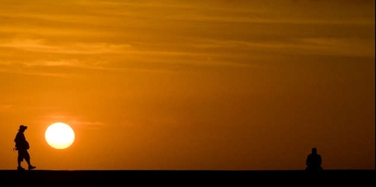 Senior Walking in Hawaii at Sunset